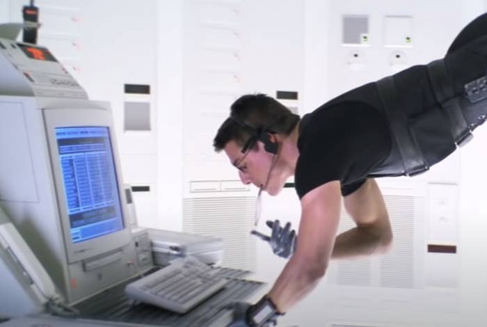 Tom Cruise in &quot;Mission: Impossible&quot; typing in a computer in a bank 