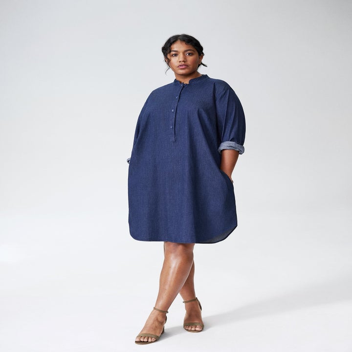 Front view of a model wearing the knee-length dress in dark indigo