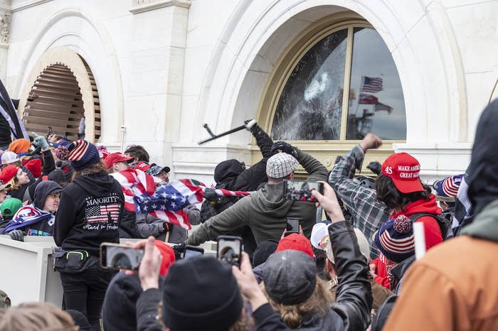 Insurrectionists smash windows at the Capitol