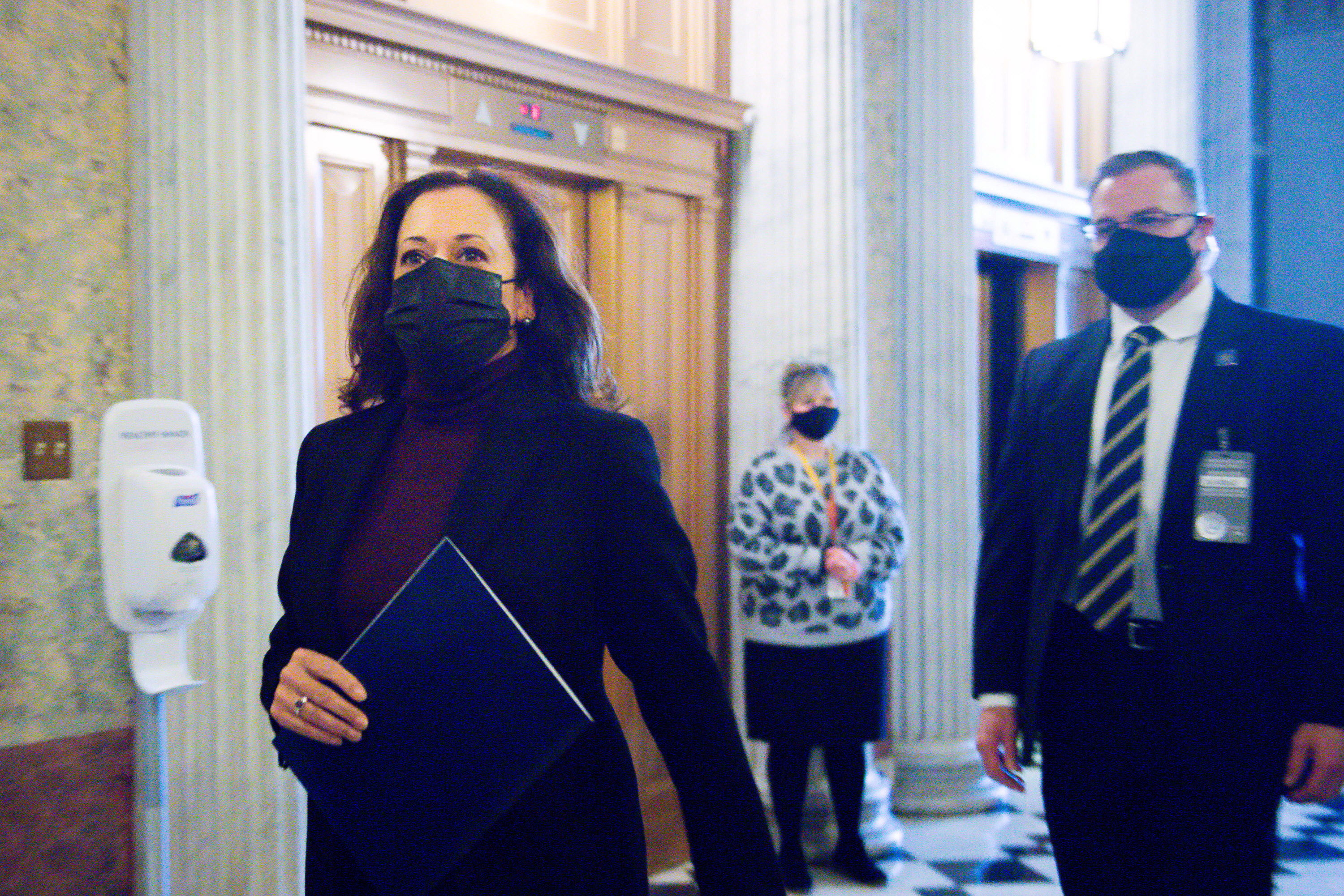 Vice President-elect Kamala Harris arrives at the U.S. Capitol wearing a mask to vote on January 1, 2021 in Washington, DC