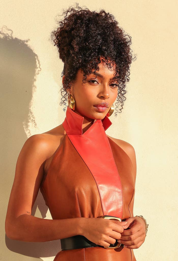 Yara Shahidi in a photoshoot with her hair curly and done up 