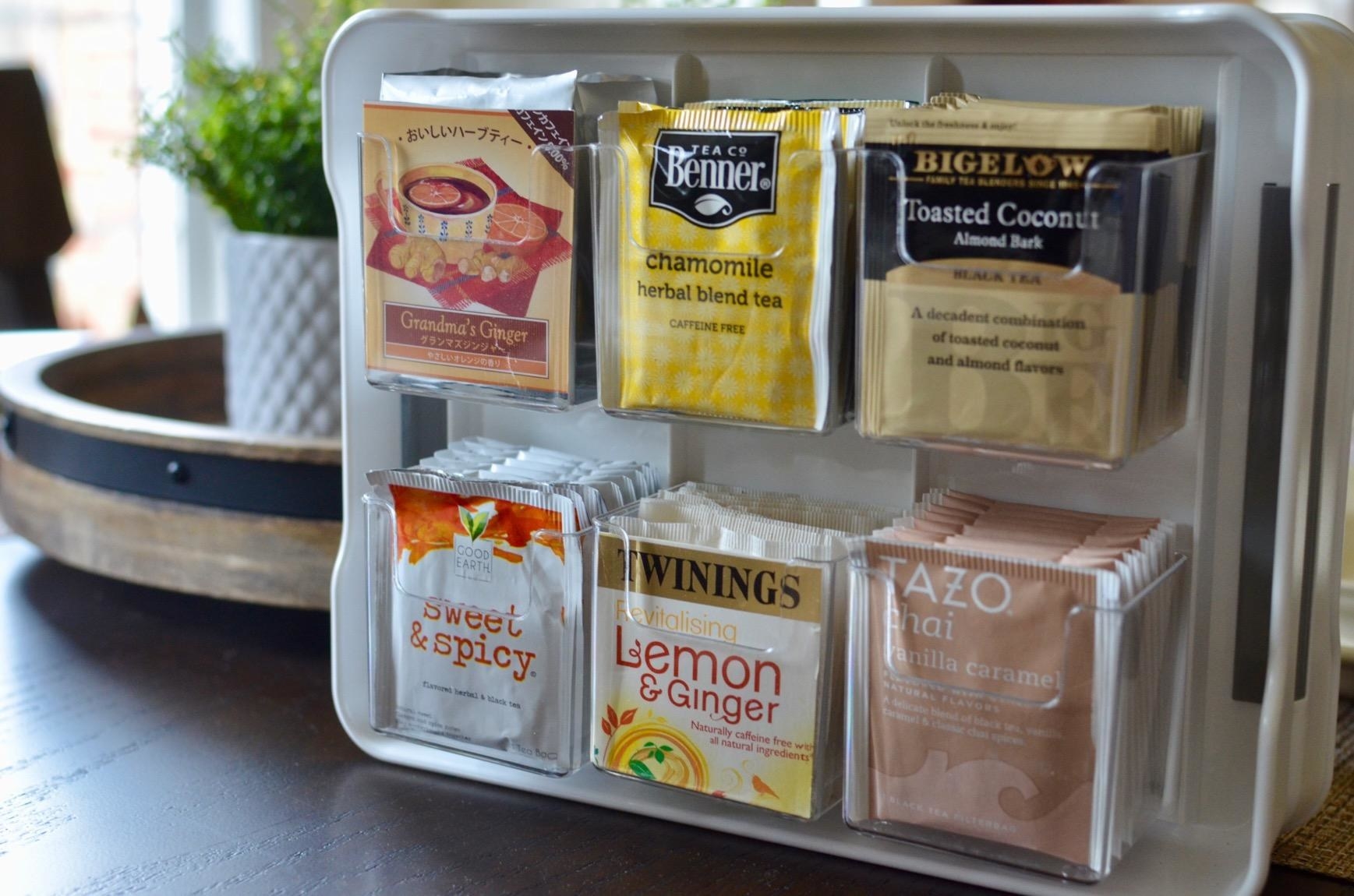 reviewer photo showing tea organizer filled with six different tea blends 