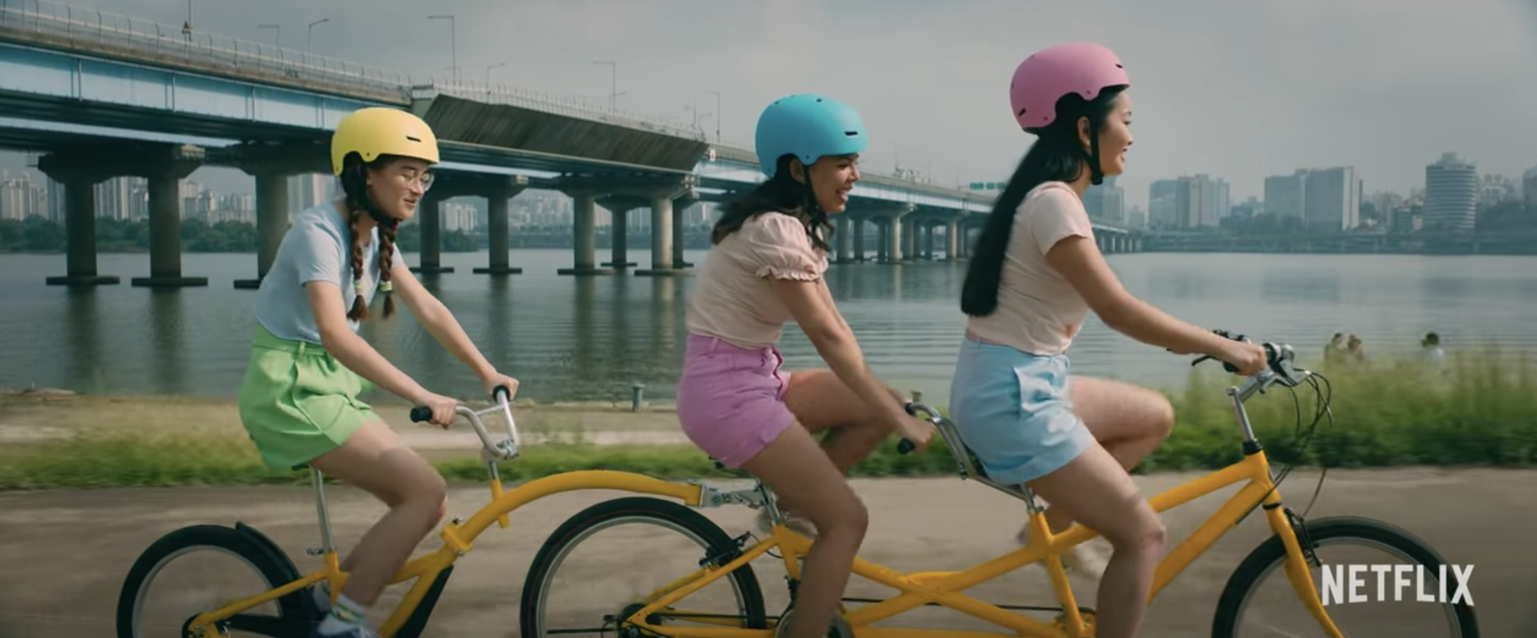 Lara Jean bicycle riding with friends