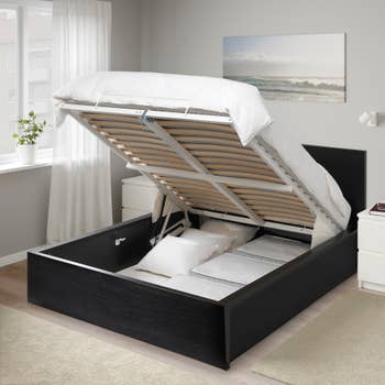 The bed open showing storage underneath