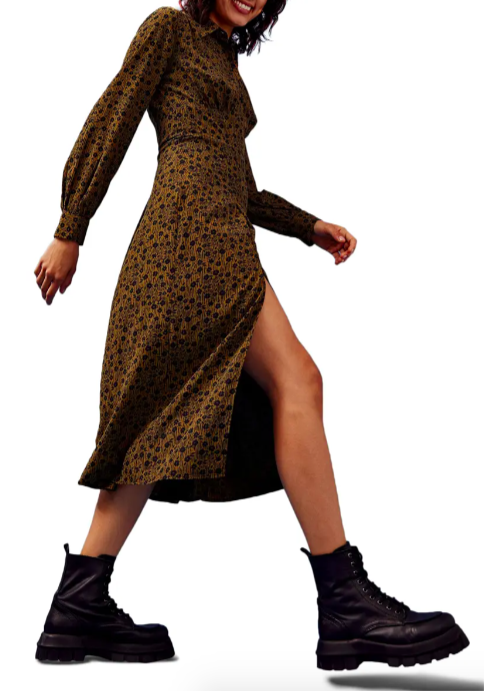 A model walking in the Floral Slit Front Long Sleeve Shirtdress