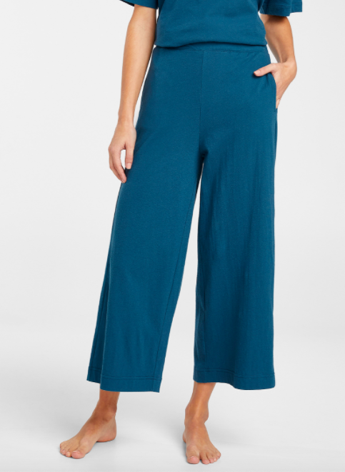 A person wearing the cropped wide leg cotton loungewear pants