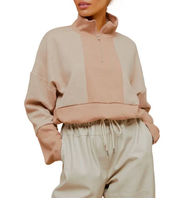 A model wearing the Fleece Panel Mock Neck Sweatshirt