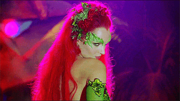 Poison Ivy turning around and winking at Batman and Robin