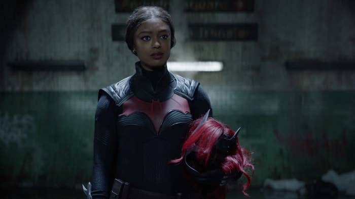 Javicia Leslie as Batwoman holding her cowl