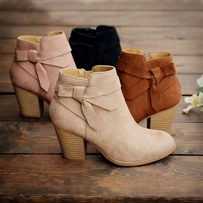 The booties with decorative knots at the ankle in tan, pink, brown, and black