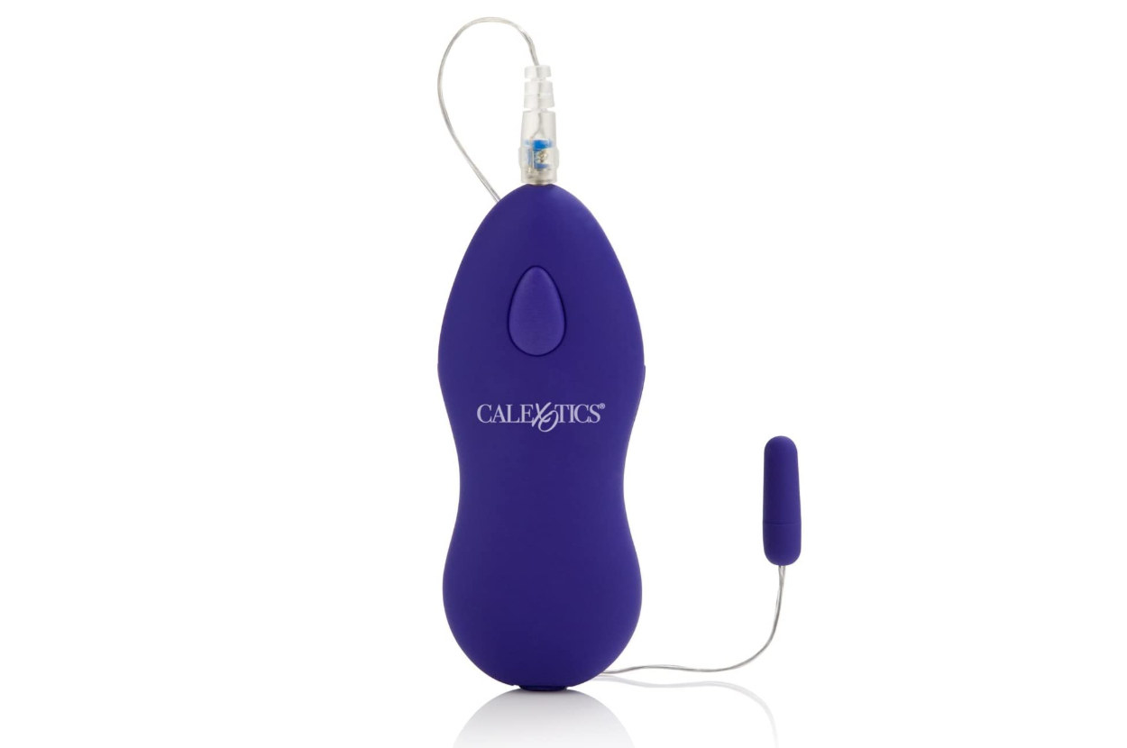 The dark blue micro bullet vibrator plugged into the ergonomic control panel with a single button