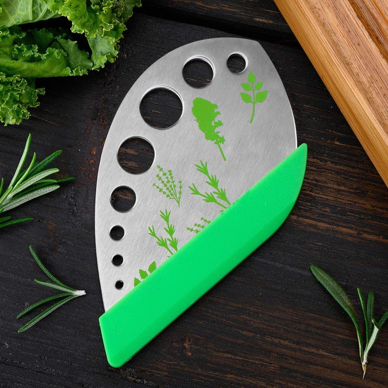 the herb stripper on a table surrounded by various herbs