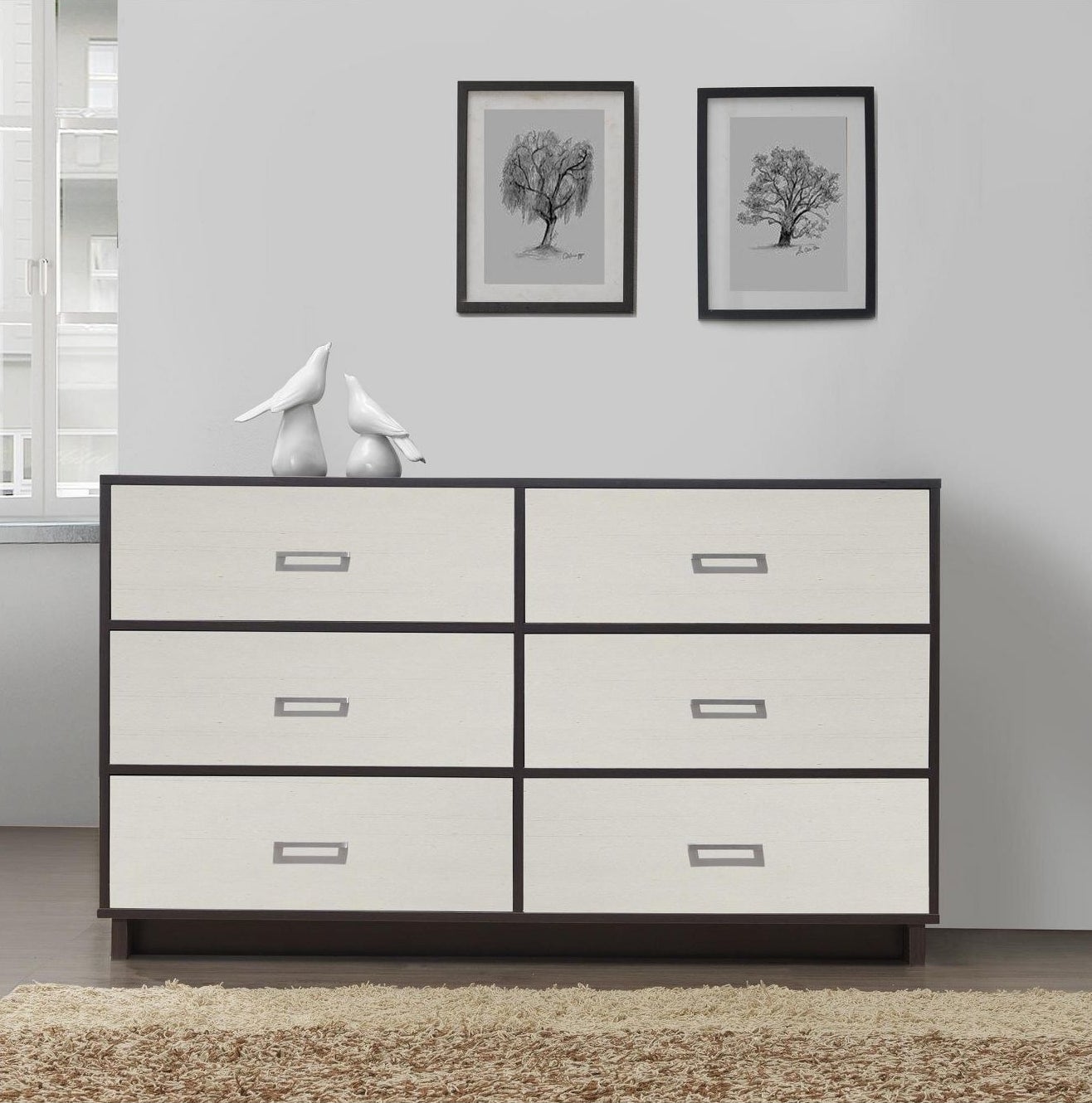 A six drawer dresser with a two tone finish in brown espresso and white and silver handles