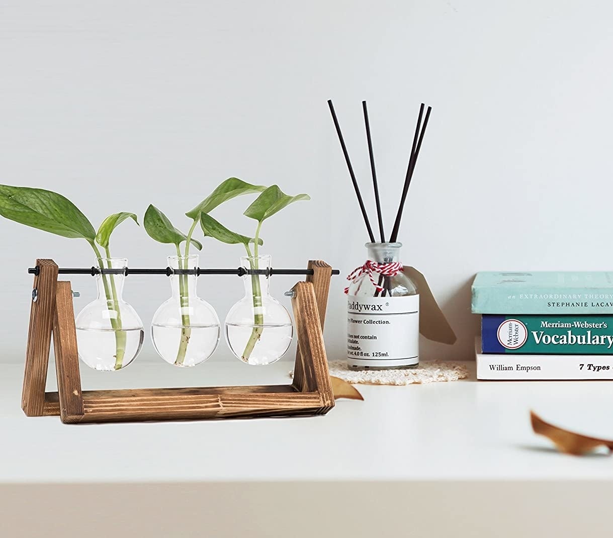 The water bulb planters on a desk beside incense and books
