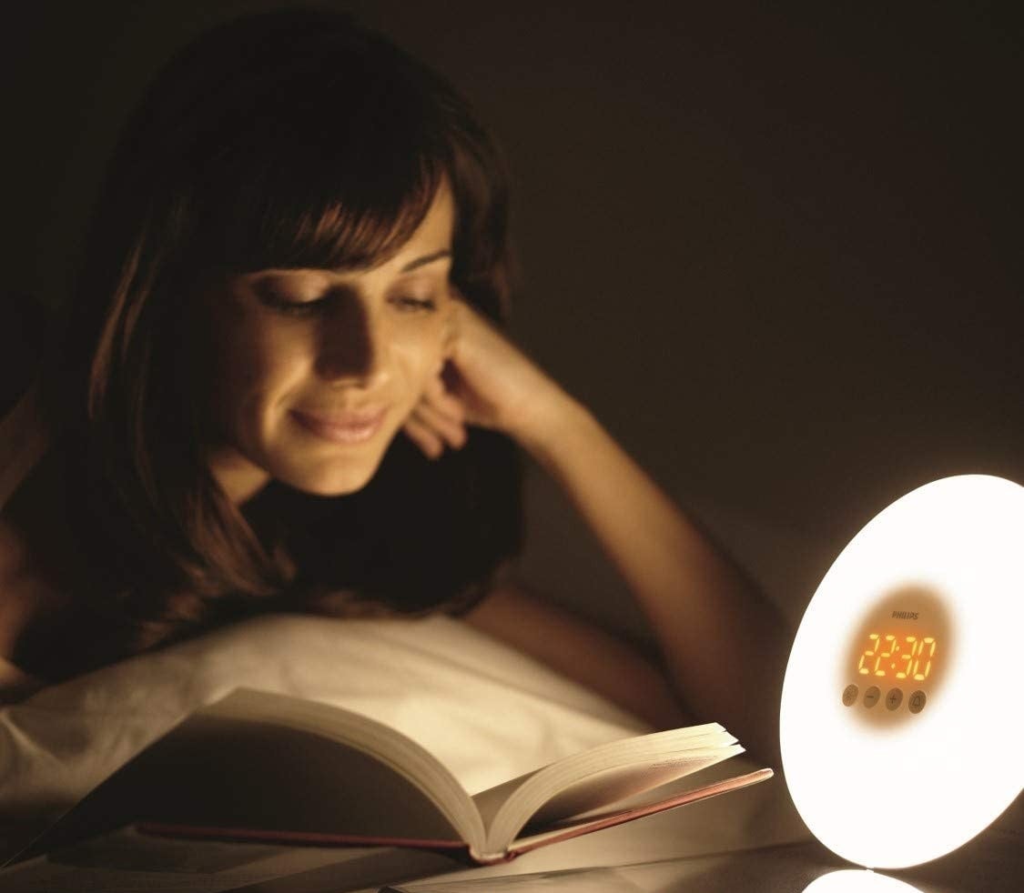 person reading with the light on