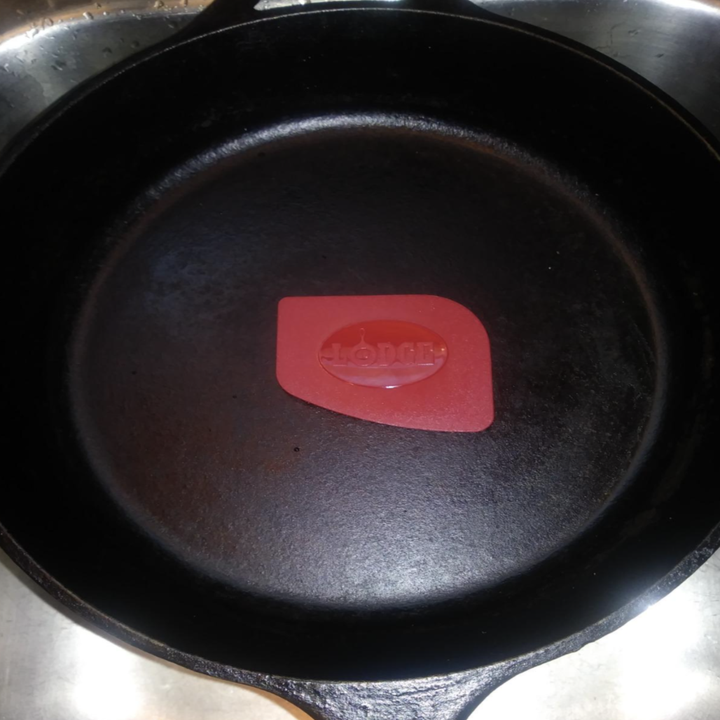 the same pan now completely clean with the scraper inside it
