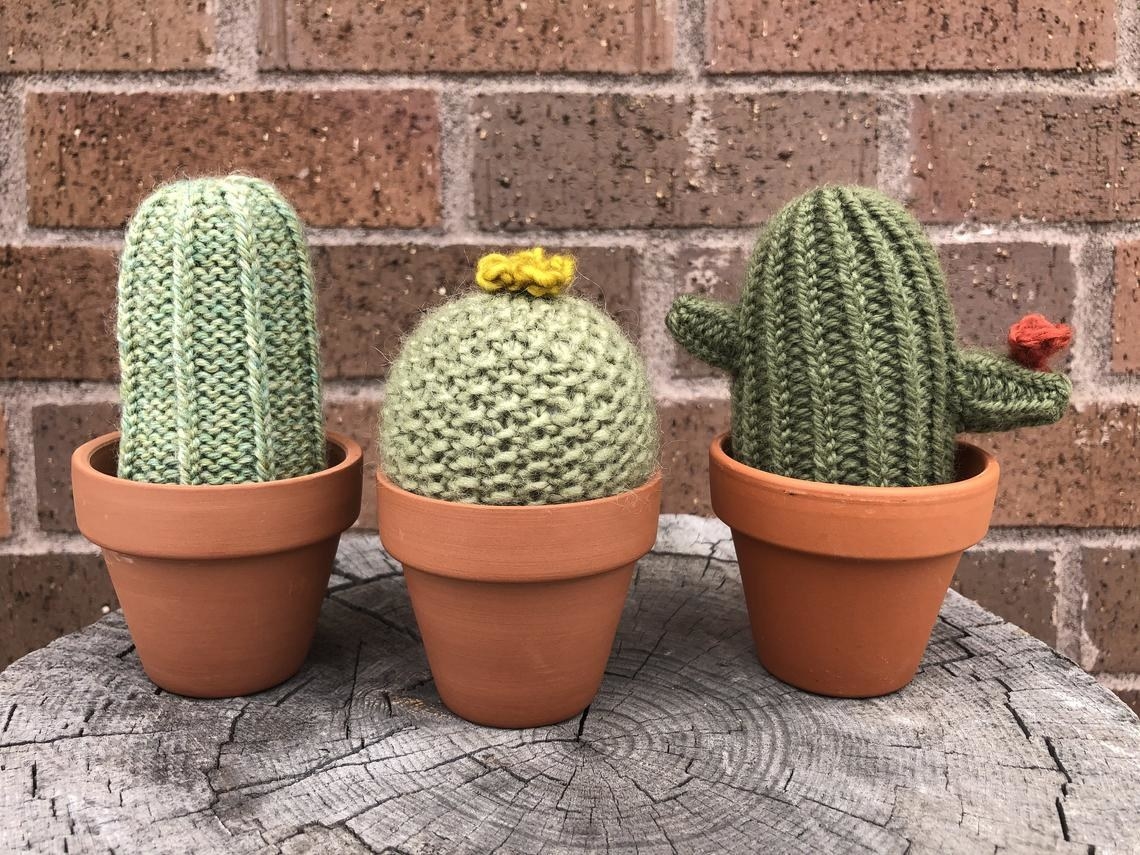 Three knit cacti in pots
