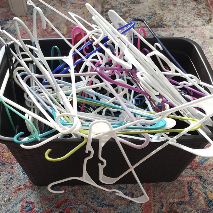 a reviewer photo of a mess of hangers in a basket