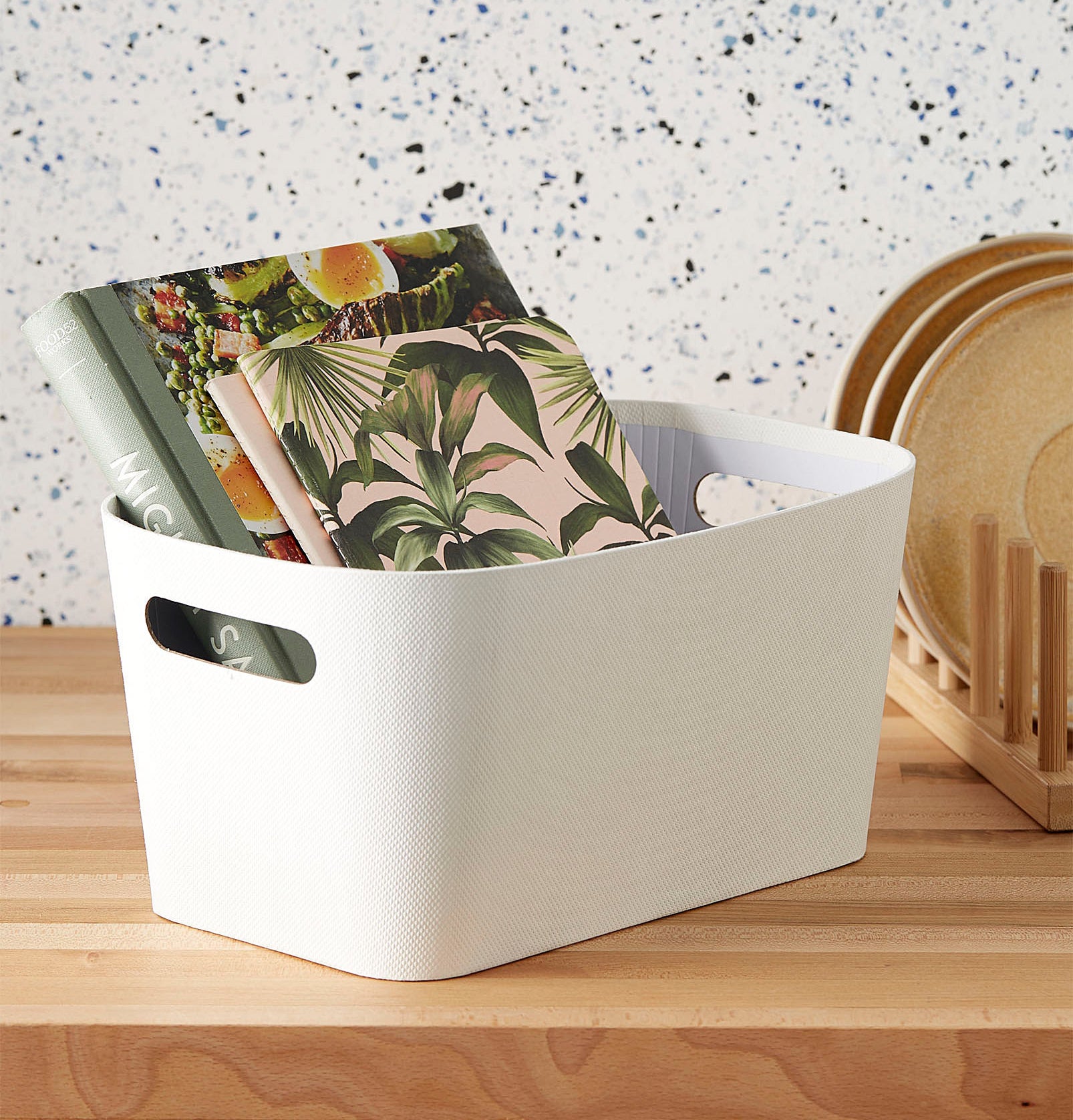 The bin with various books inside