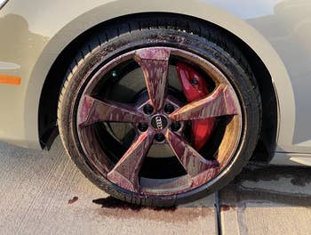 a reviewer's tire looking purple and dirty
