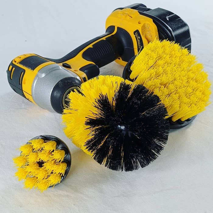 A drill with a large brush attached to the end