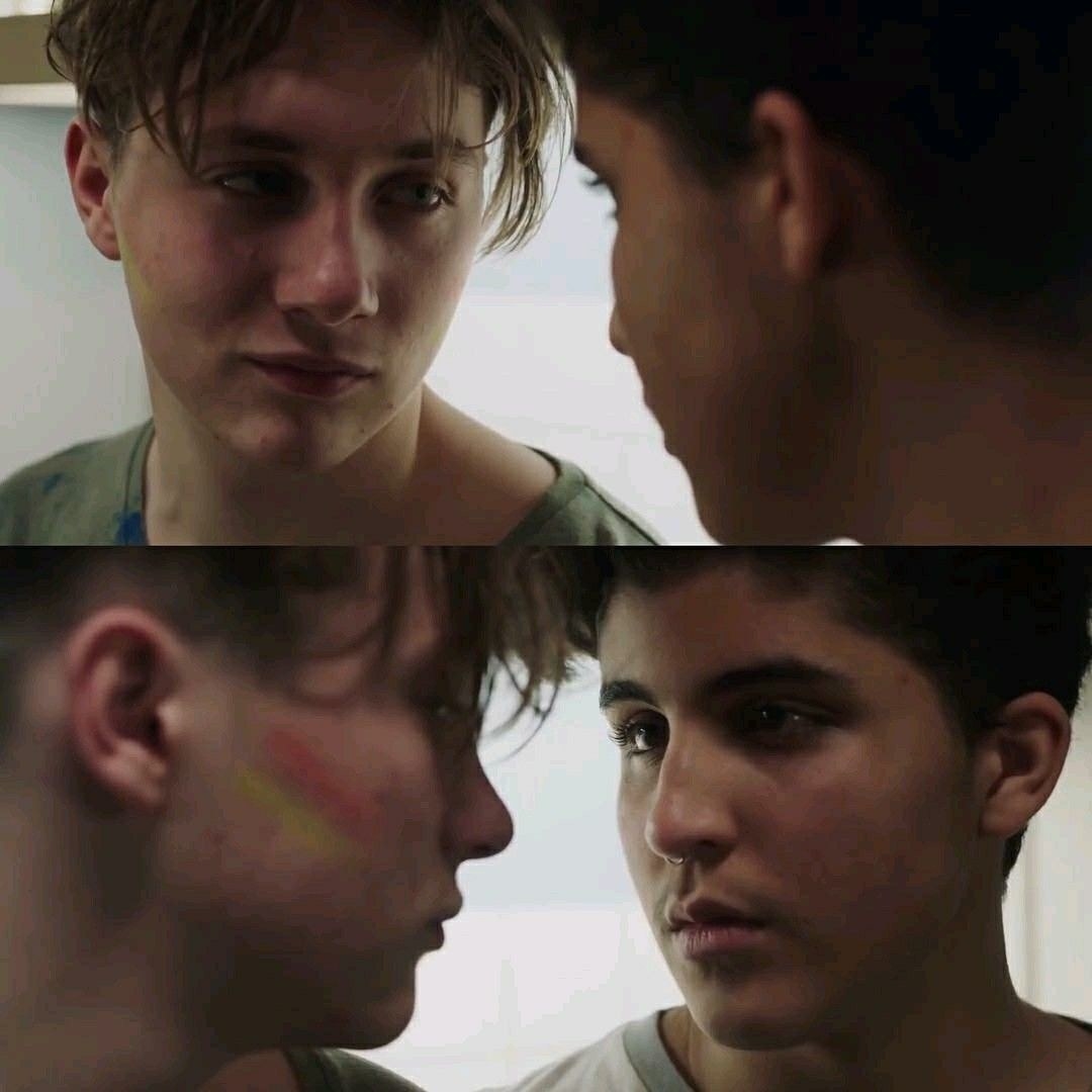 Matteo and David looking at each other with deep love and admiration