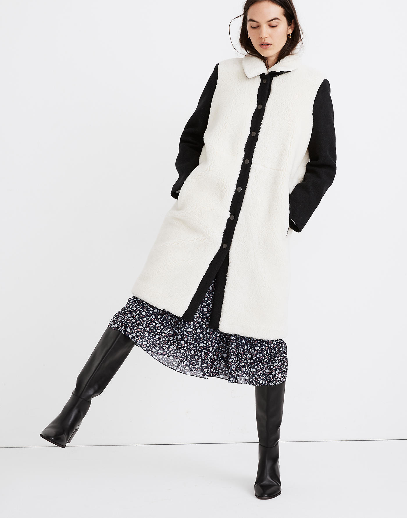 Model wearing black and white coat