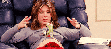 Rachel from Friends balancing a can of pop on her bump