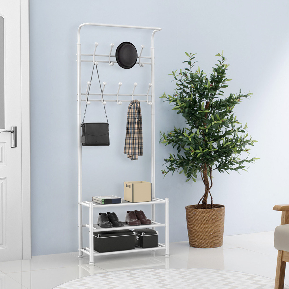 white hall tree with accessories and coat hanging on the racks and shoes and boxes on the shelves below