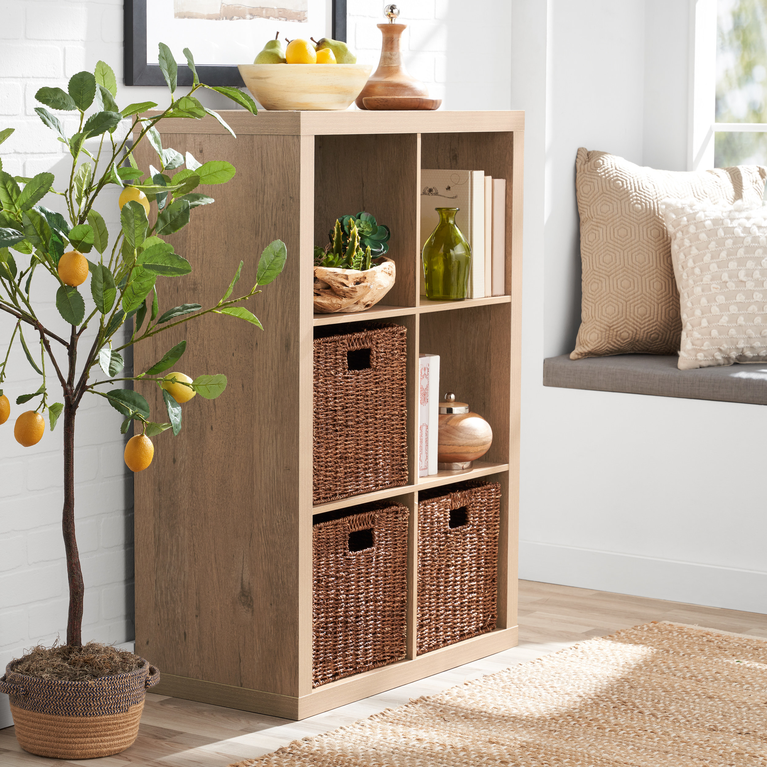 natural wood colored organizer with books and storage bins inside