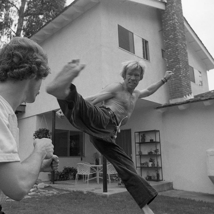 Chuck Norris performing a martial arts kick
