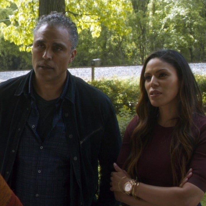 Darius and his lady companion talking to someone at their front door 