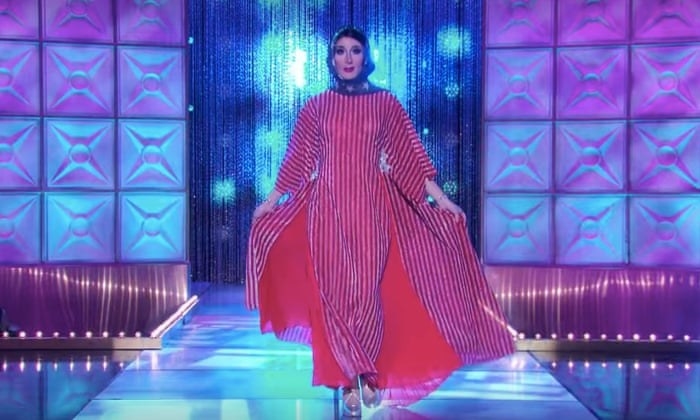 Jackie walking down the RPDR runway in a USA stars and stripes hajib 