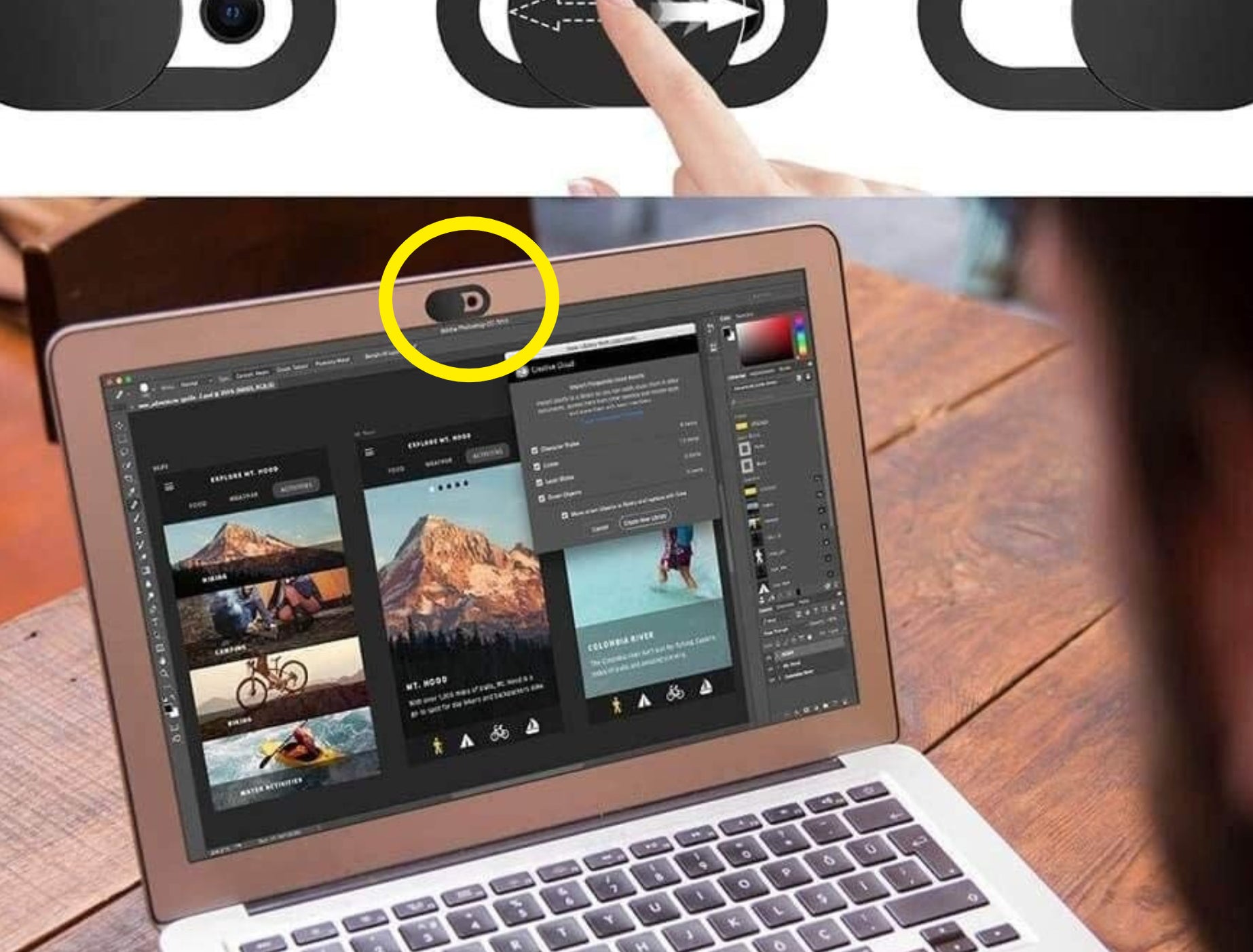 A person using their laptop that has a webcam cover over their camera