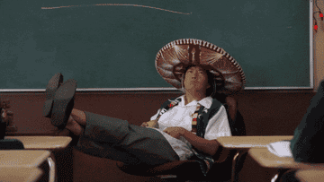 Man in sombrero at front of classroom