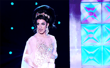 GIF of Jackie on the runway dressed like a character from Valley of the Dolls