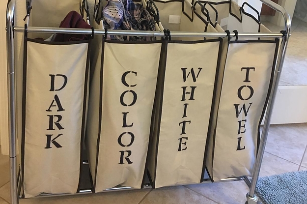 reviewer photo showing laundry organizer that they stenciled with the words dark, color, white, and towel