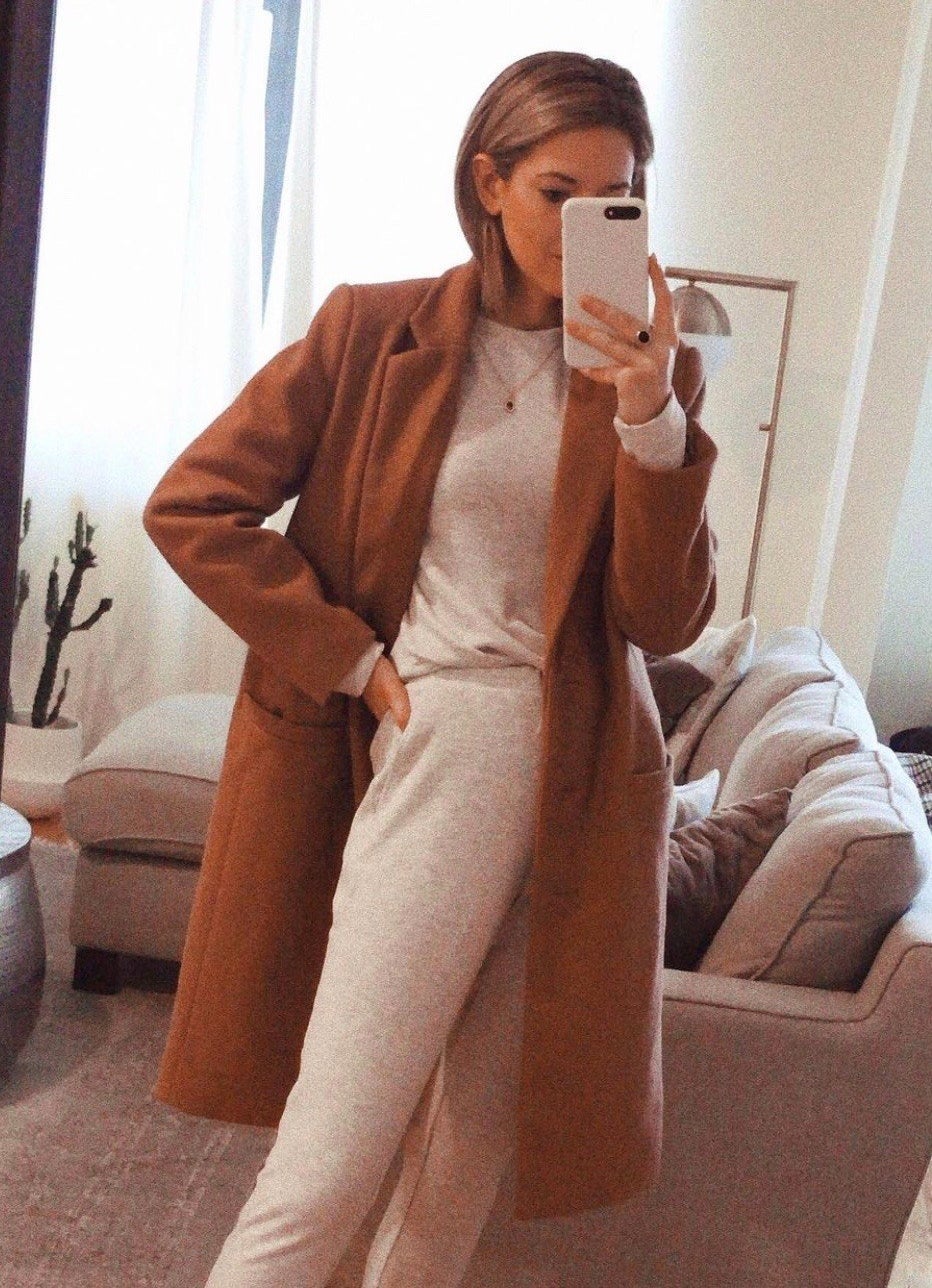 Reviewer wearing the coat in tan