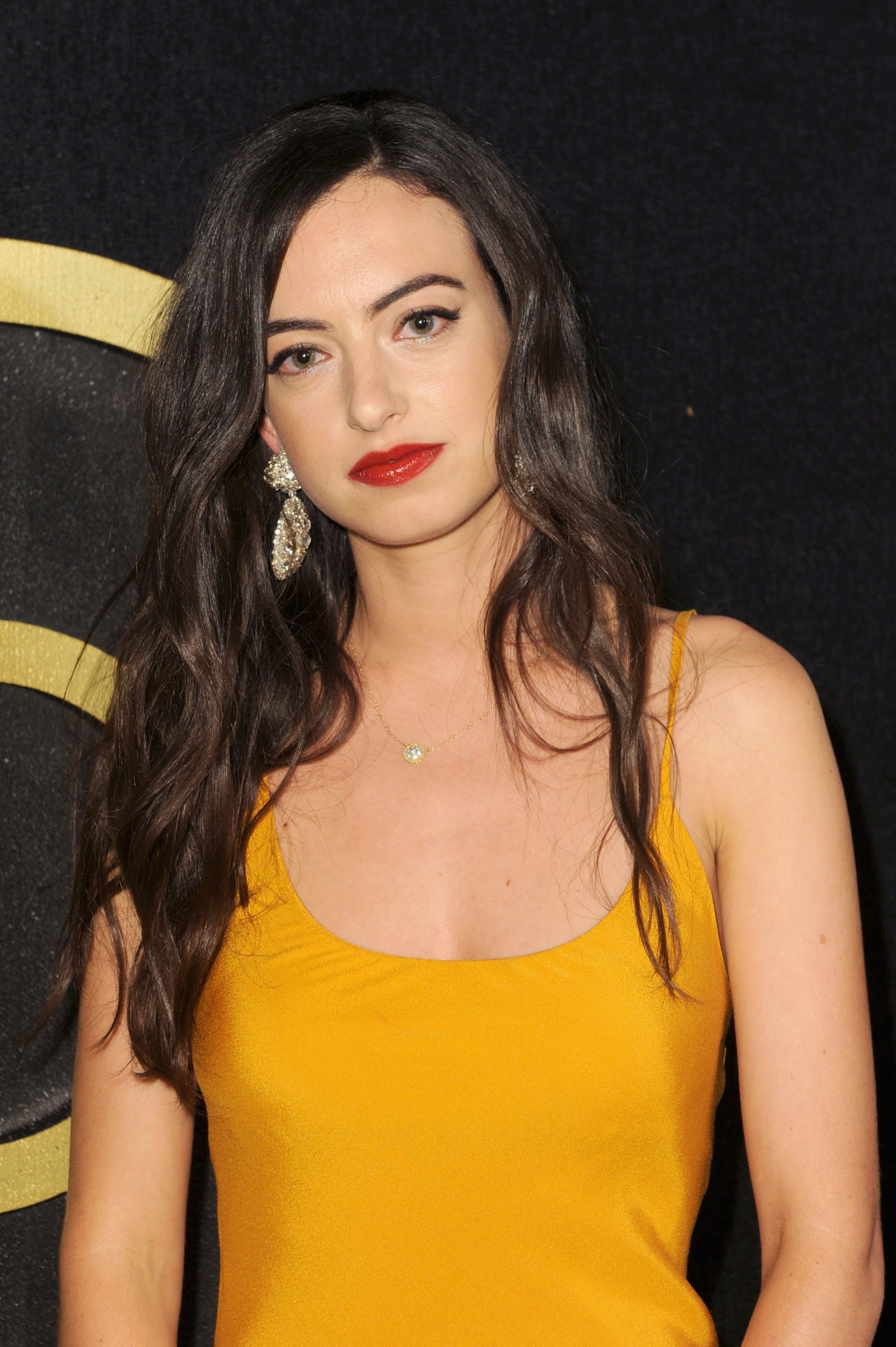 Cazzie David wearing a yellow dress on the red carpet