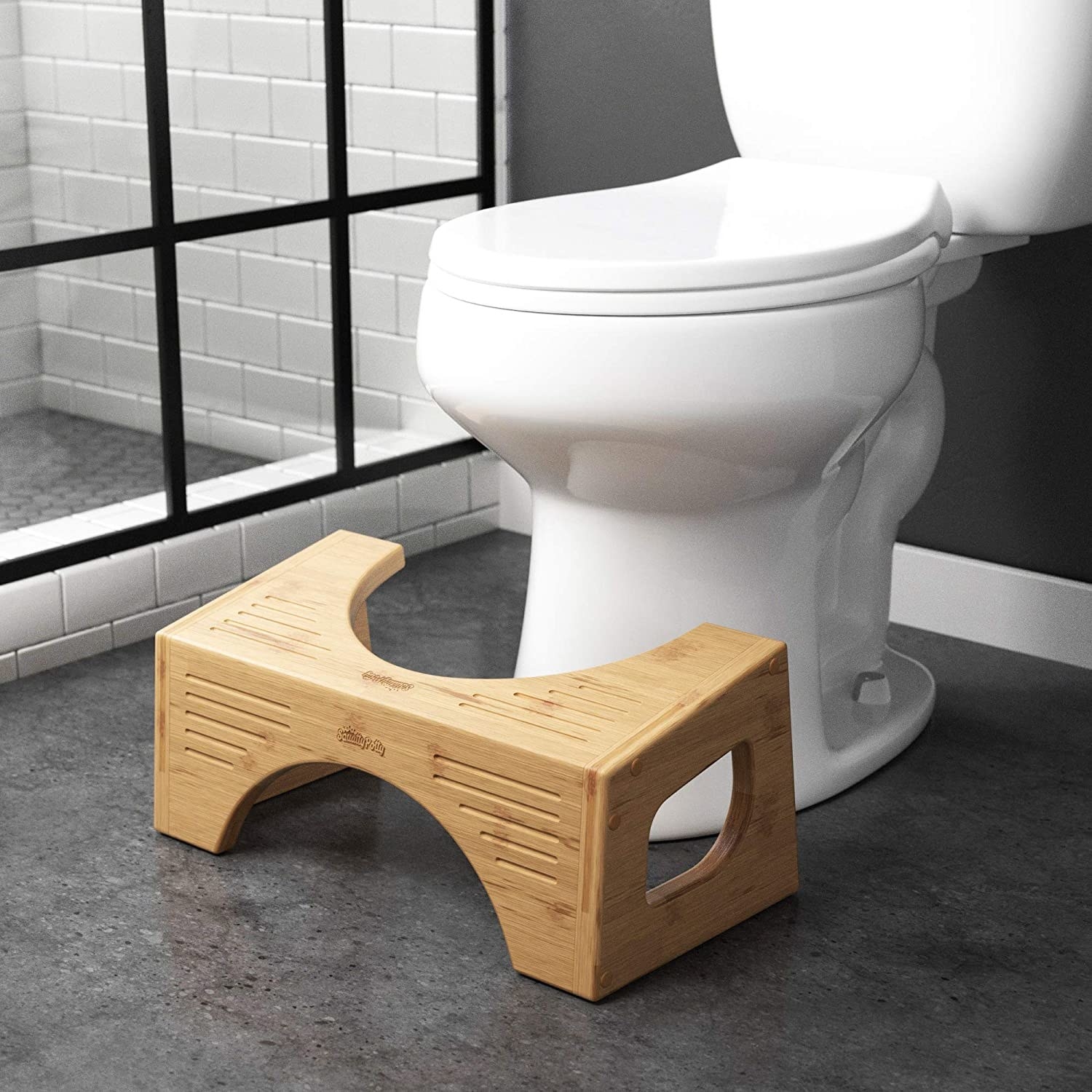 The Squatty Potty in front of a toilet