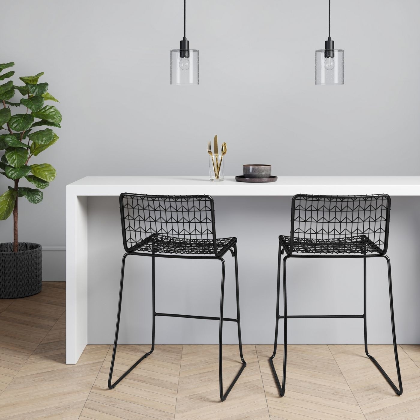 Two black oster wire bar stools