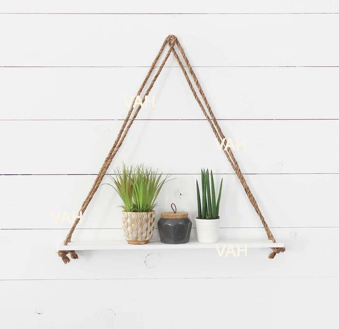 A triangular shelf on a wall