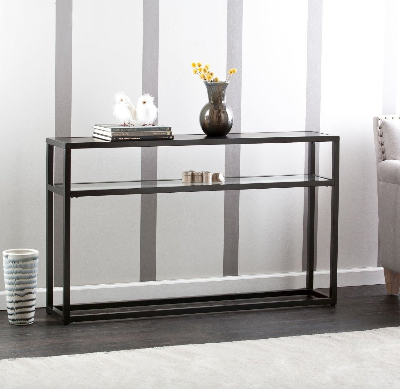 A black console table with a glass top