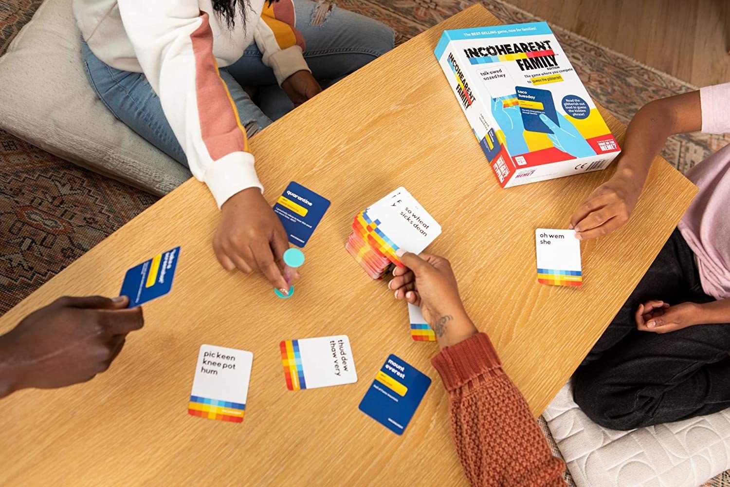 a group of people that are playing a round of the cards