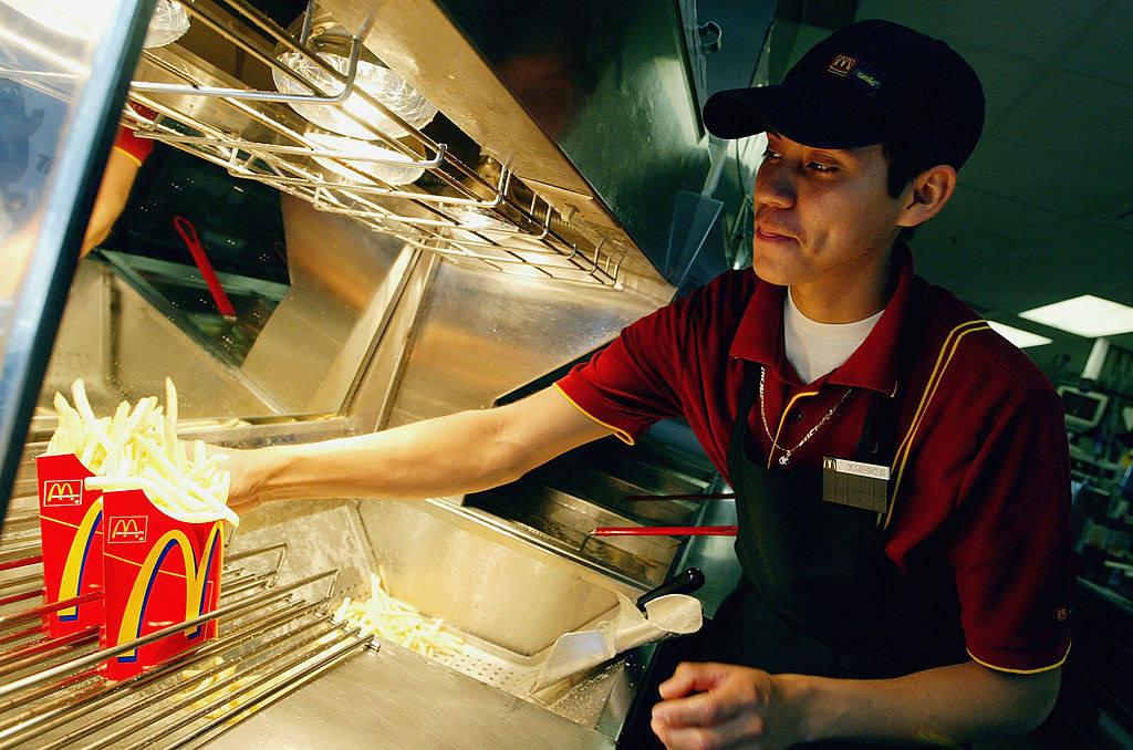 Sergio Laua works the french fry counter at a McDonald&#x27;s restaurant in Redwood City, California