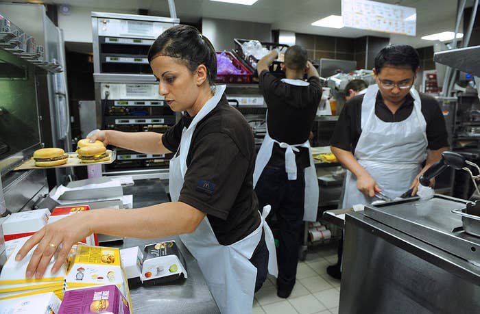 Behind the scenes of McDonald&#x27;s employees making food at the location in Beaugrenelle