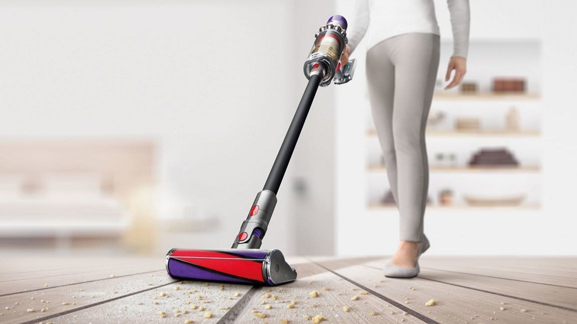 person pushing the Dyson vacuum