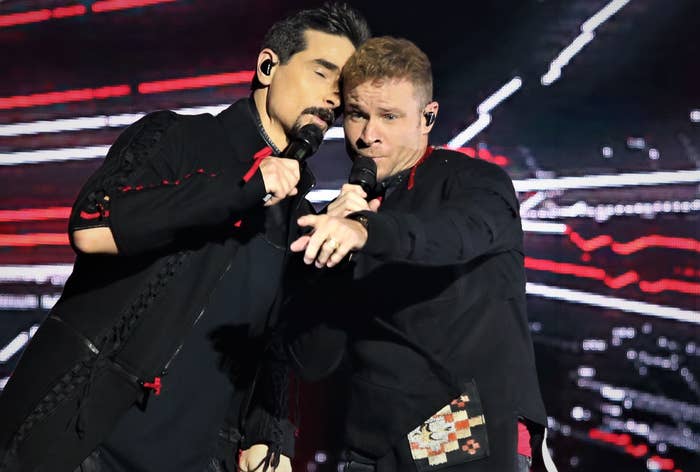 Brian Littrell and Kevin Richardson performing onstage 