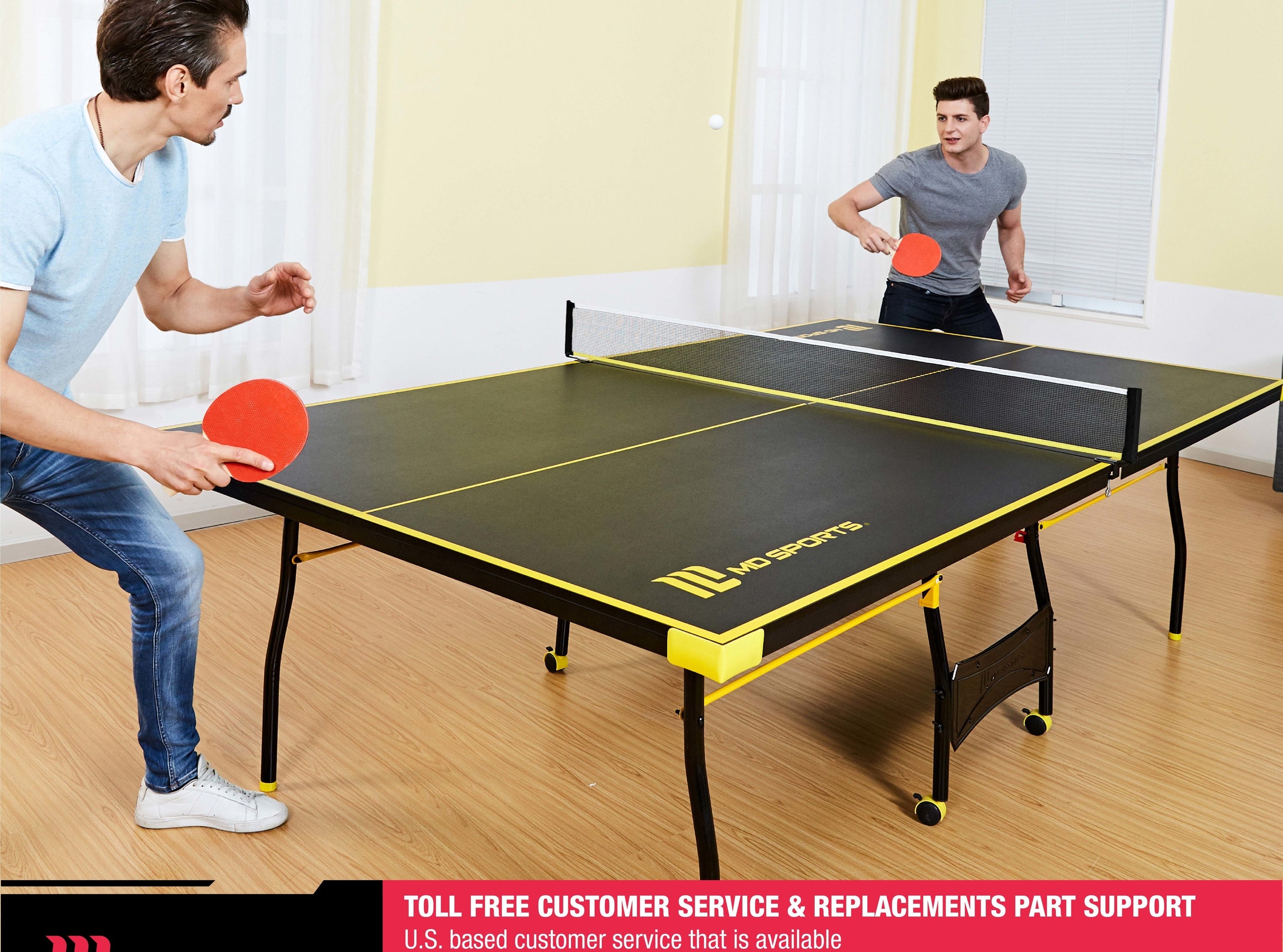 two people playing ping pong over a table tennis table