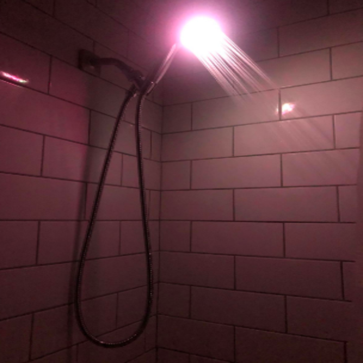 Adjustable shower head with LED lights glowing